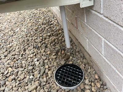 Gravity drain pipe through wall